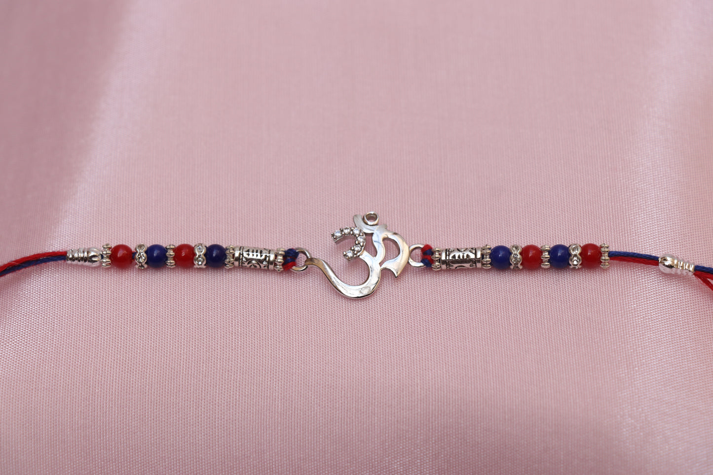 Om Silver Rakhi