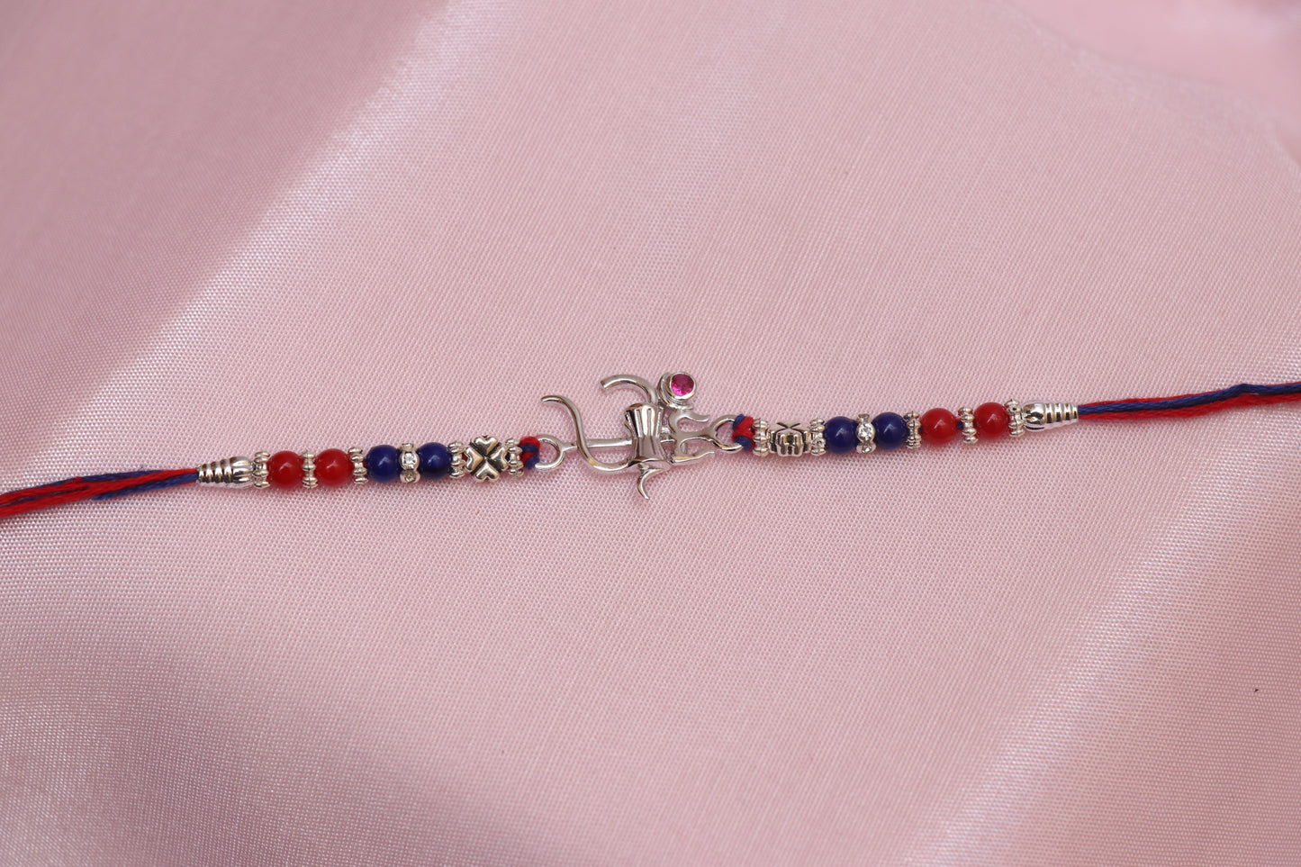 Om Trishul Red Stone Silver Rakhi